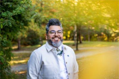 Tiburcio Lince, director of Grand Valley's Office of Multicultural Affairs, poses for a photo on Grand Valley's campus.